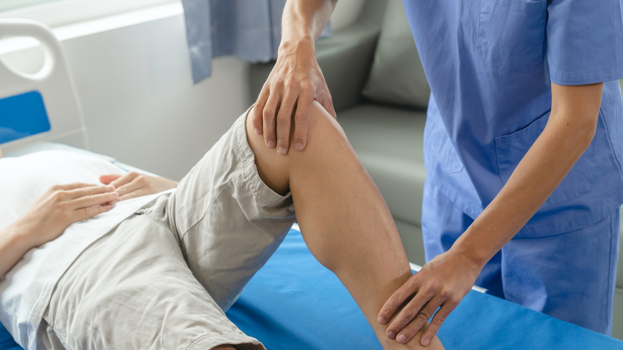 Athlete undergoing physiotherapy with a musculoskeletal specialist after sports and gym injuries.